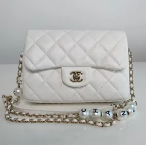 Chanel Pearl Logo Strap Flap Bag White