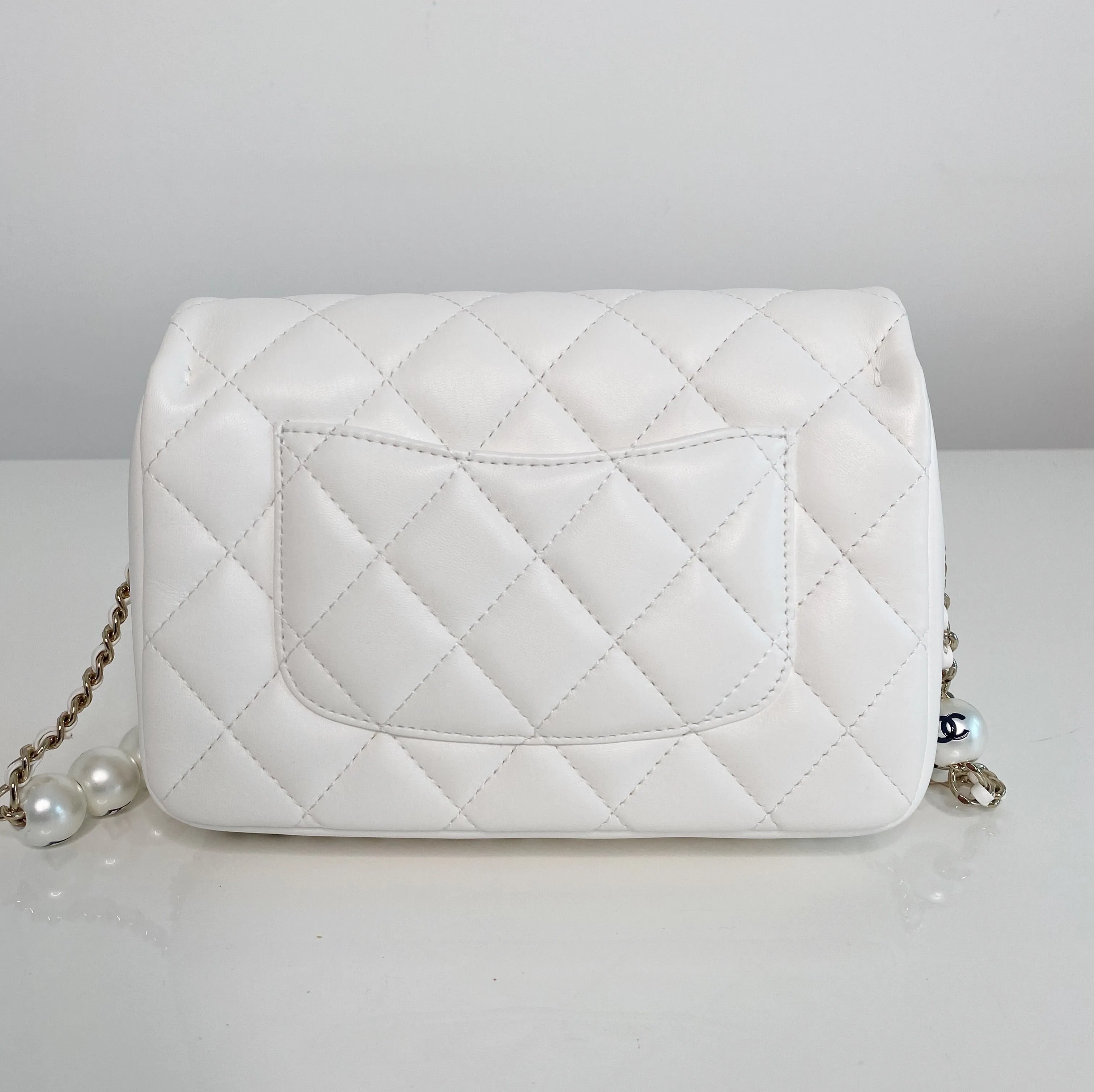 Chanel Pearl Logo Strap Flap Bag White