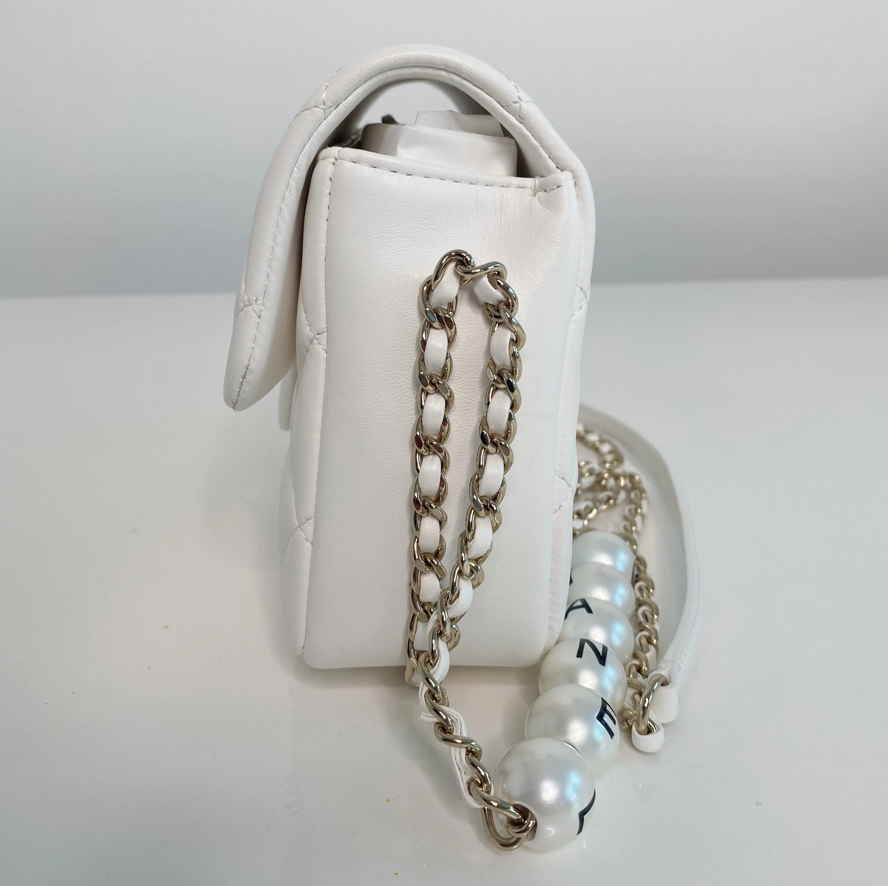 Chanel Pearl Logo Strap Flap Bag White